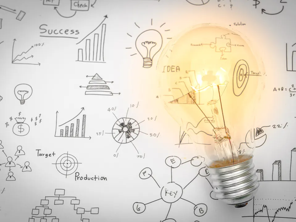 Schizzi di idee, grafici e una lampadina: la diagnosi dell'impresa